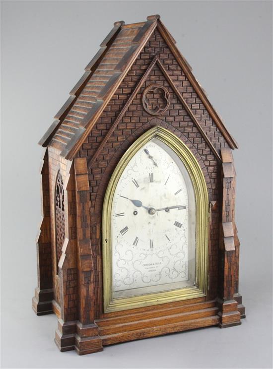 Carrew & Rule, Fenchurch Street, London. A Victorian Gothic design oak hour repeating bracket clock, clock 21in., bracket 15.5in.